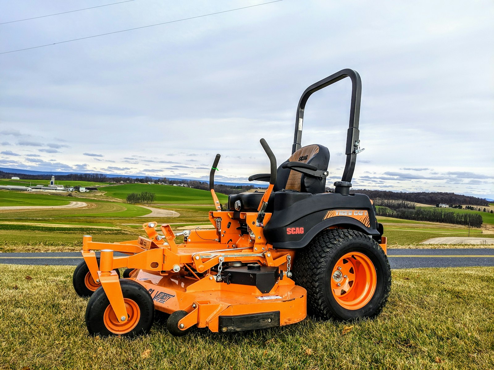 Zero-turn mower working a hillside lawn